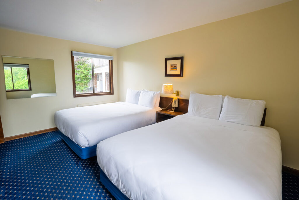 aspinquid lodge two queen river view apartment beds view toward window