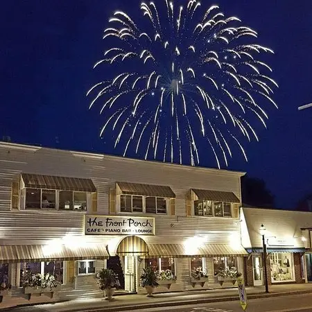 front porch restaurant with fireworks above it